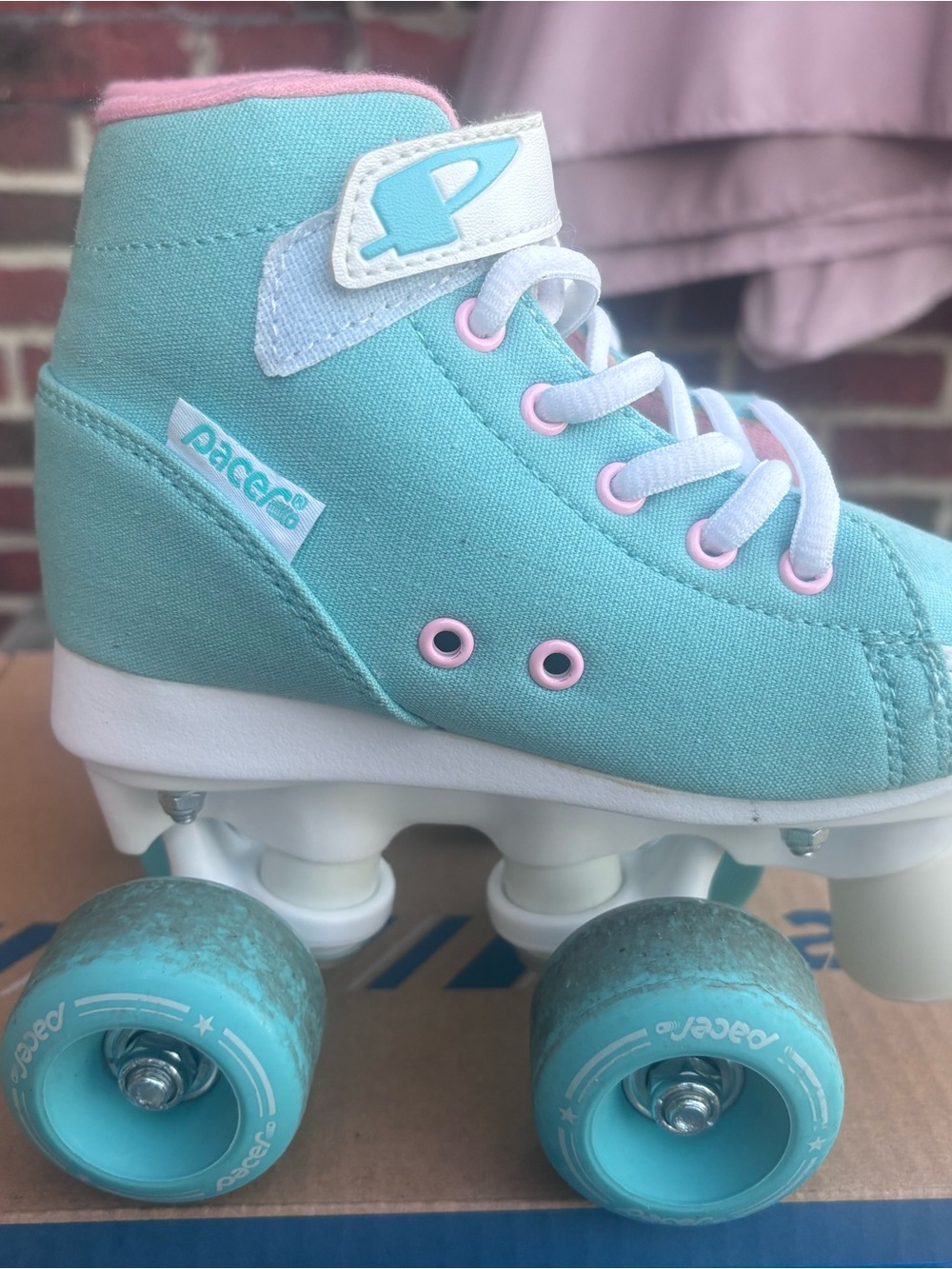 Kids Roller Skates by Pacer. Size 12-runs small. Aqua canvas with pink details.